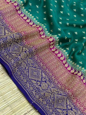 "Bottle Green Pure Banarasi Crepe Silk Saree with intricate traditional weaving, perfect for weddings and celebrations. The saree features a luxurious drape and rich, elegant color, showcasing the beauty of Indian craftsmanship."