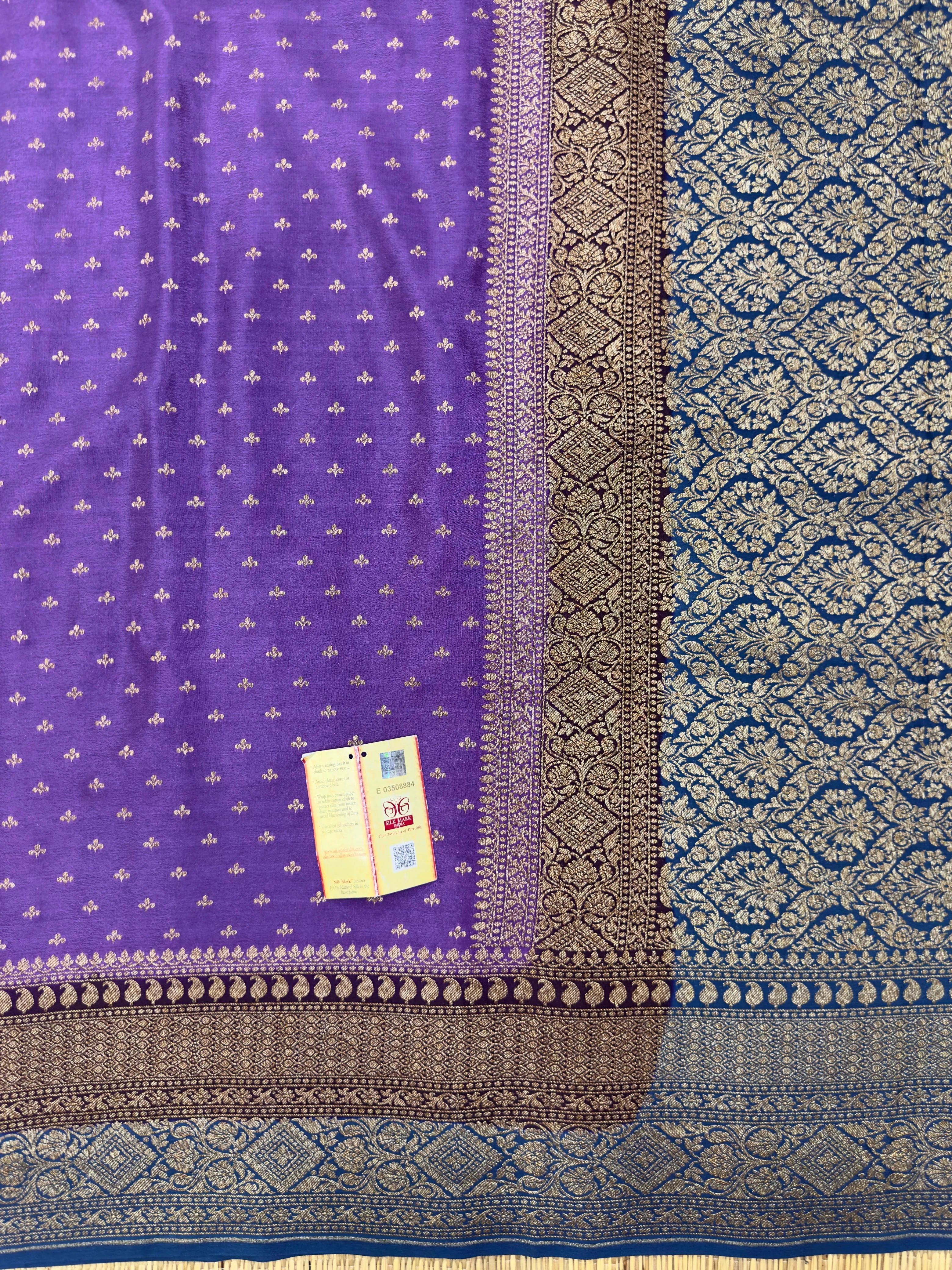 "Timeless Violet Pure Banarasi Crepe Silk Saree with intricate weaving, ideal for weddings and celebrations. The saree features a luxurious drape and vibrant violet color."