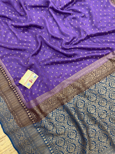 "Timeless Violet Pure Banarasi Crepe Silk Saree with intricate weaving, ideal for weddings and celebrations. The saree features a luxurious drape and vibrant violet color."