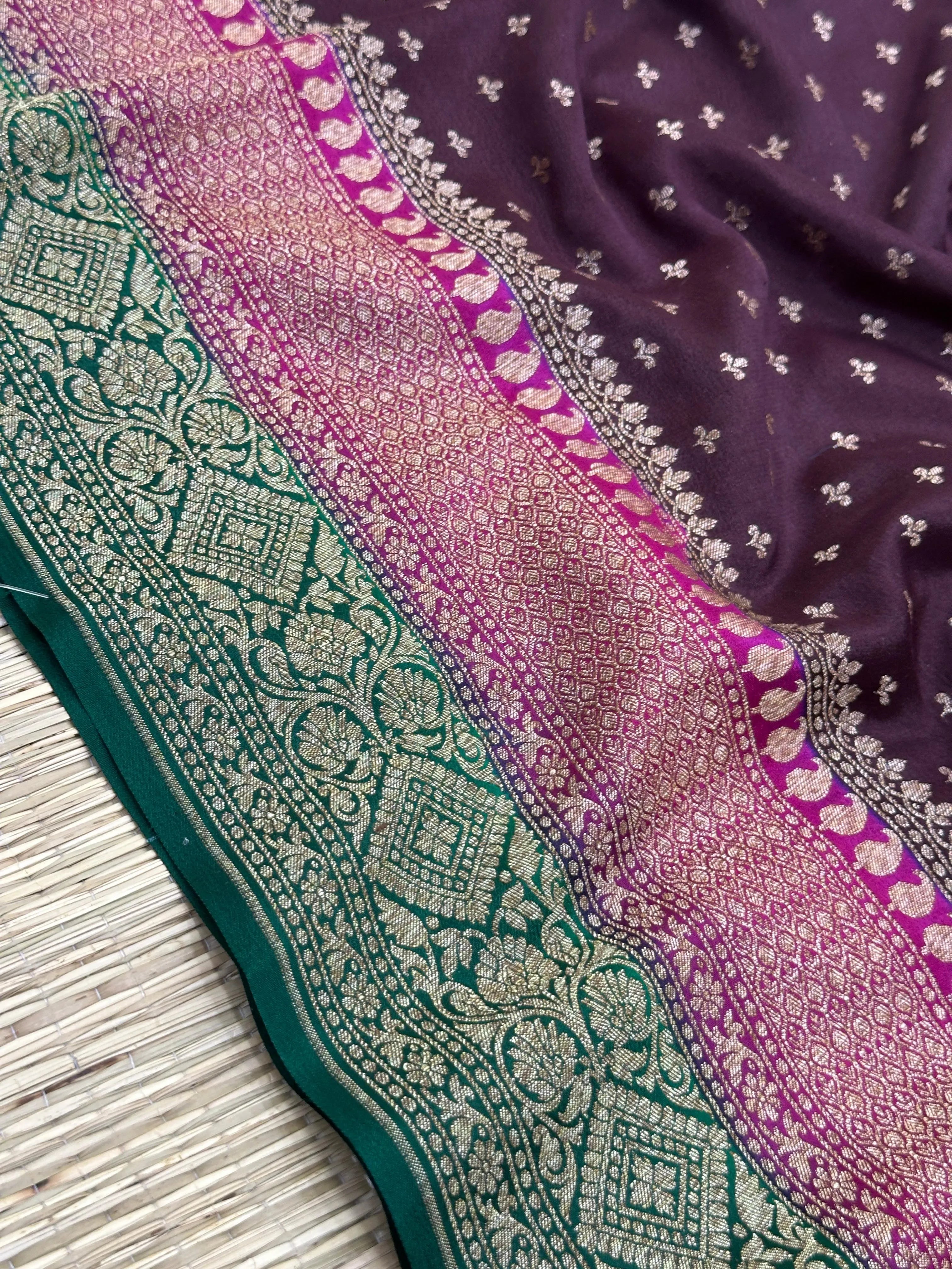 "Luxurious Wine Pure Banarasi Crepe Silk Saree with intricate handwoven patterns, perfect for weddings and celebrations. Features a rich wine color and graceful drape."