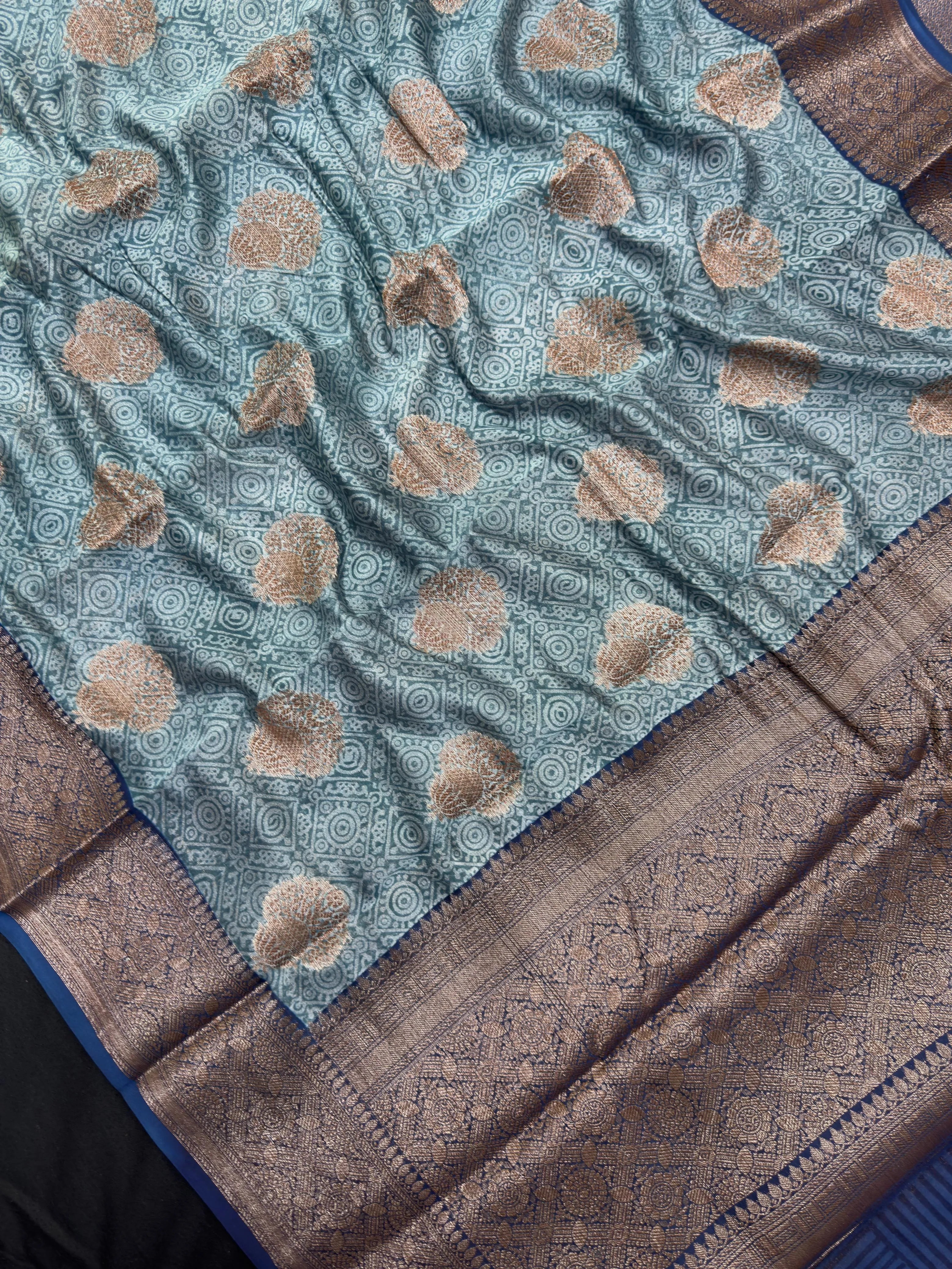Woman draped in a Pure Chinya Silk Saree with glossy finish and elegant zari work, ideal for weddings and festive occasions.