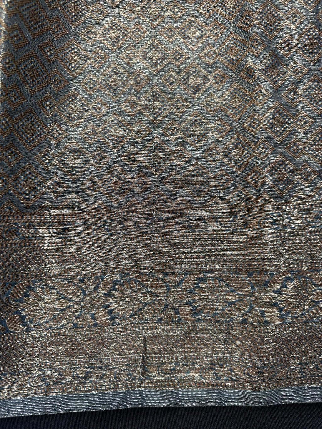 Woman wearing a traditional Chinya Silk Saree in elegant colors with woven pallu and festive motifs, ideal for weddings and Indian celebrations.