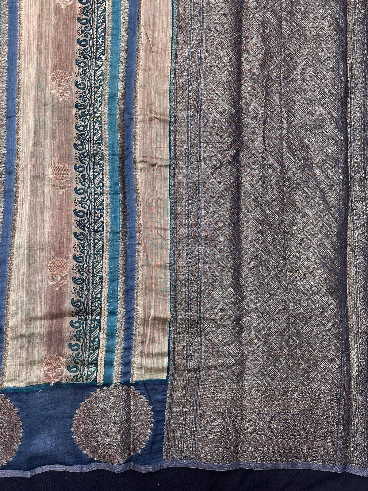 Woman wearing a traditional Chinya Silk Saree in elegant colors with woven pallu and festive motifs, ideal for weddings and Indian celebrations.