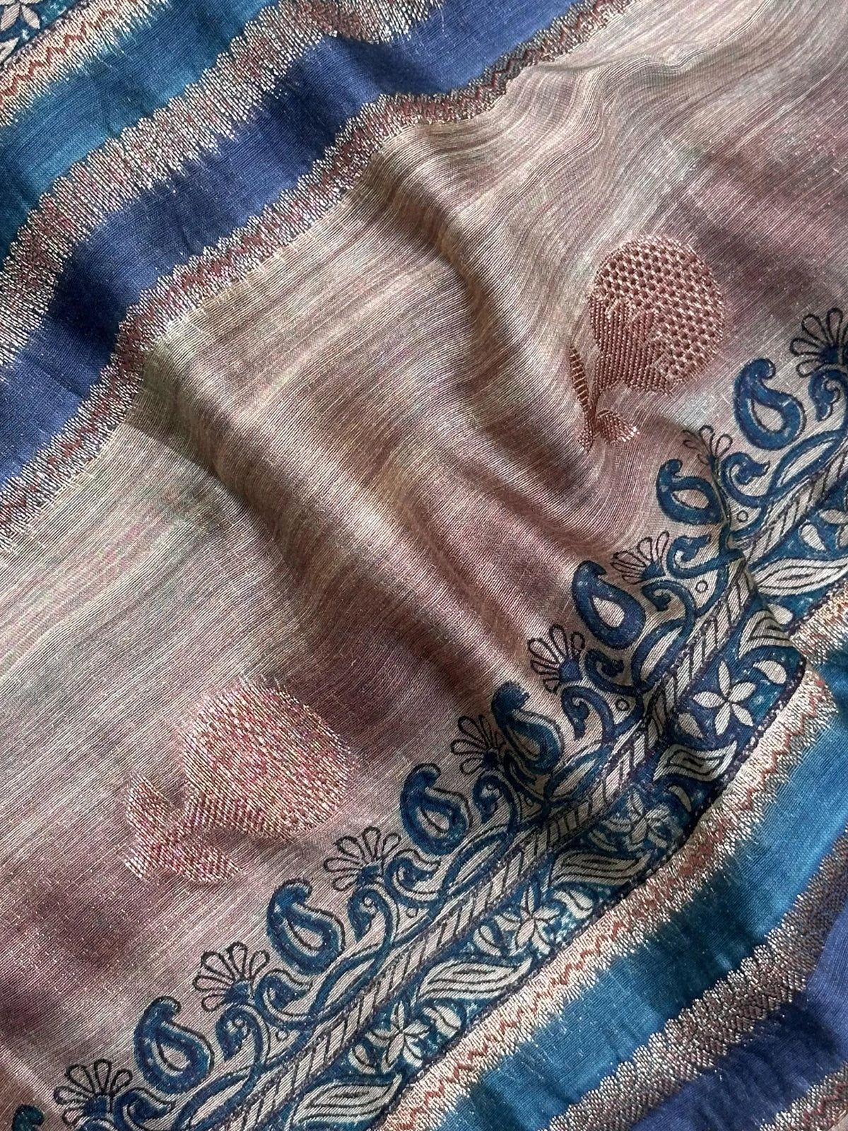 Woman wearing a traditional Chinya Silk Saree in elegant colors with woven pallu and festive motifs, ideal for weddings and Indian celebrations.