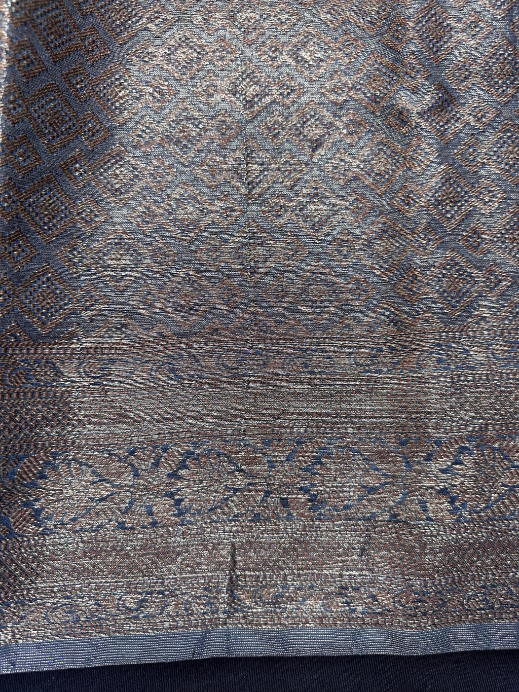 Woman wearing a traditional Chinya Silk Saree in elegant colors with woven pallu and festive motifs, ideal for weddings and Indian celebrations.