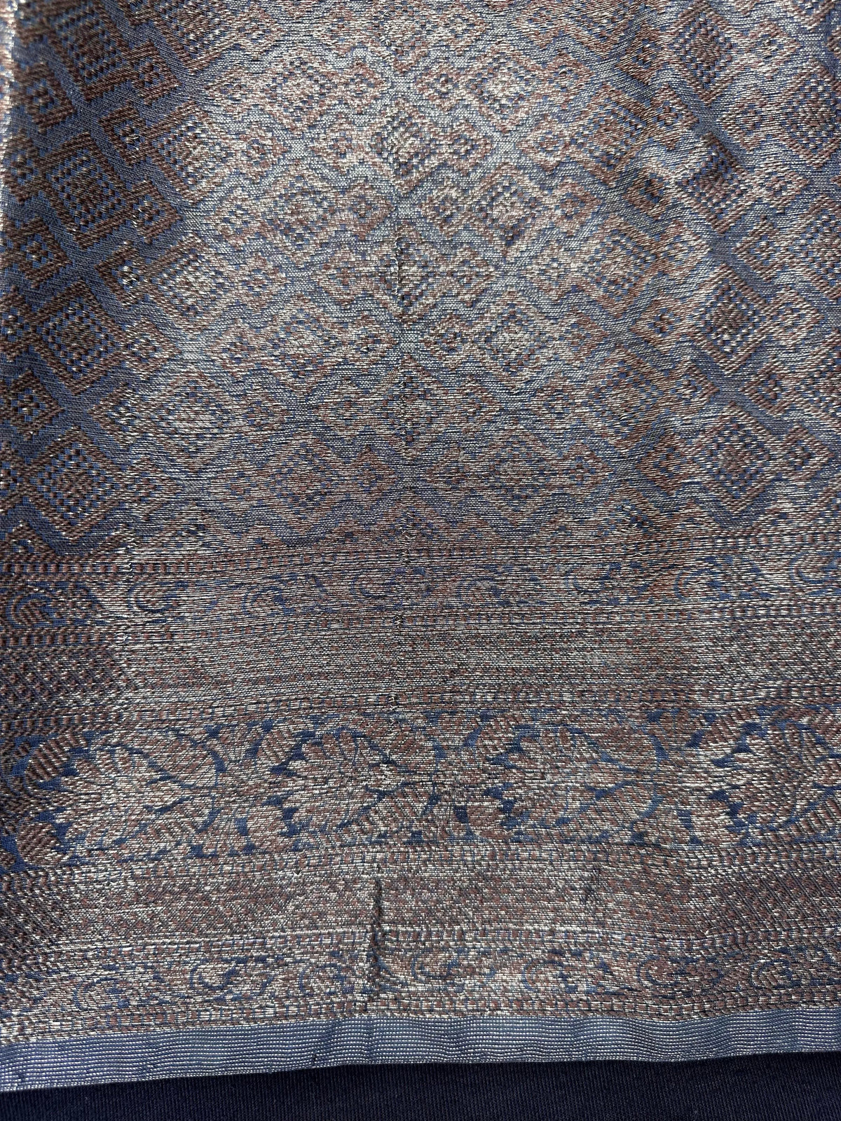 Woman wearing a traditional Chinya Silk Saree in elegant colors with woven pallu and festive motifs, ideal for weddings and Indian celebrations.