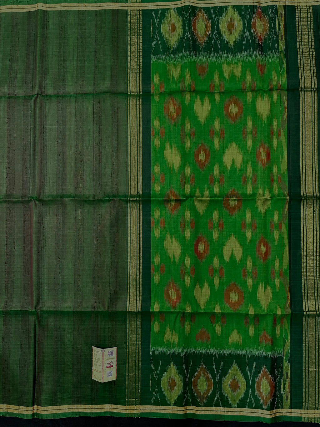 Woman wearing a Pure Dupion Silk Saree with vibrant Pochampally Ikat pallu – a stylish blend of texture and tradition.