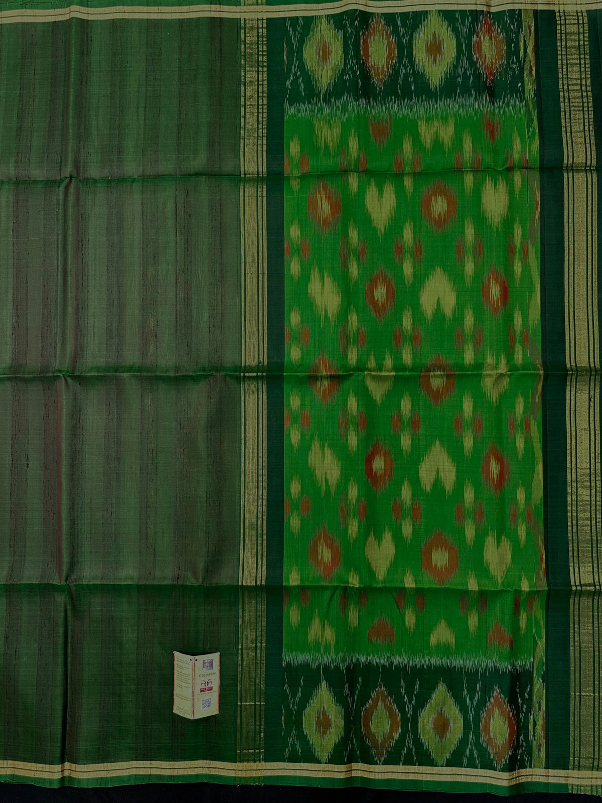 Woman wearing a Pure Dupion Silk Saree with vibrant Pochampally Ikat pallu – a stylish blend of texture and tradition.