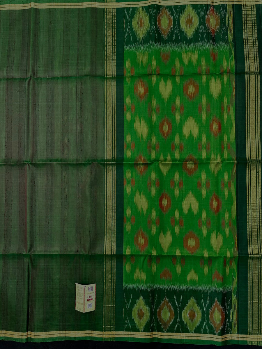 Woman wearing a Pure Dupion Silk Saree with vibrant Pochampally Ikat pallu – a stylish blend of texture and tradition.