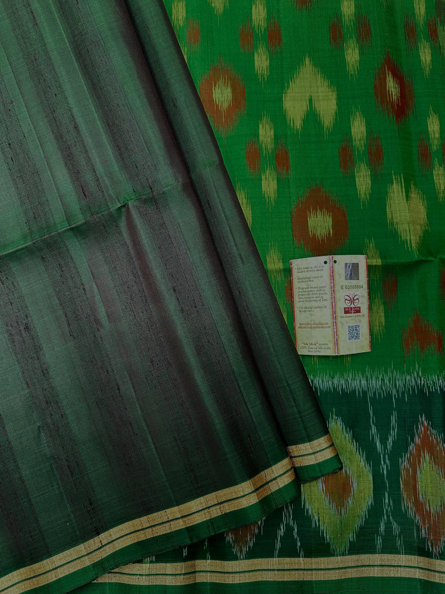Woman wearing a Pure Dupion Silk Saree with vibrant Pochampally Ikat pallu – a stylish blend of texture and tradition.
