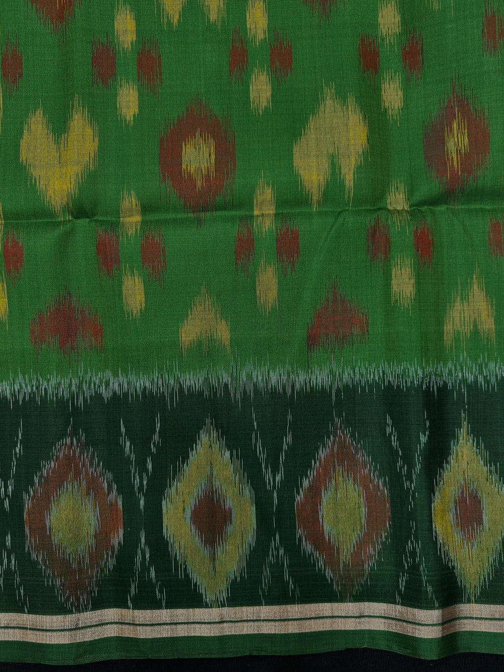 Woman wearing a Pure Dupion Silk Saree with vibrant Pochampally Ikat pallu – a stylish blend of texture and tradition.