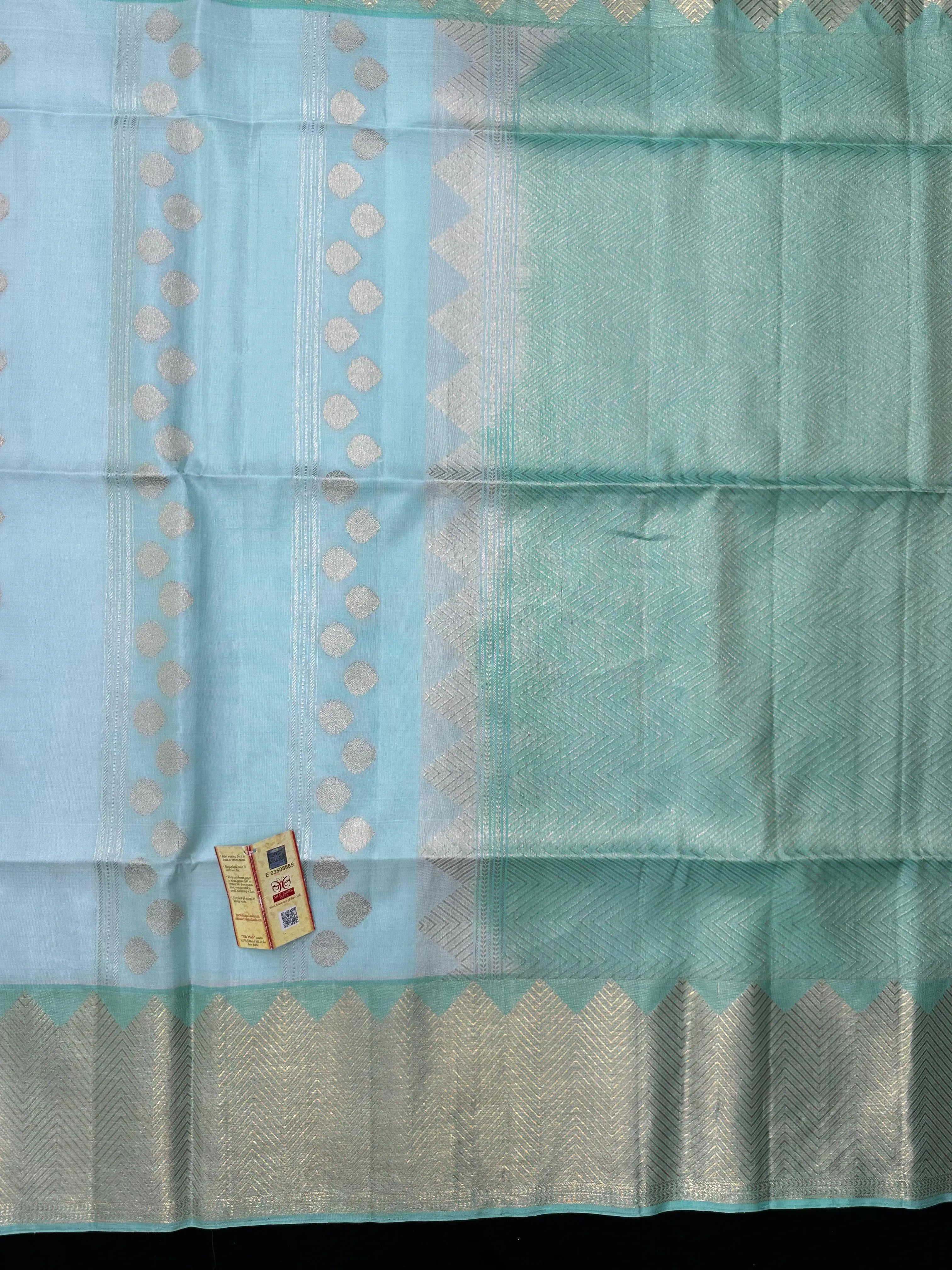 Woman draped in a Pure Kanjivaram Silk Saree with rich silk texture, vibrant colors, and traditional zari border, ideal for weddings and festivals.