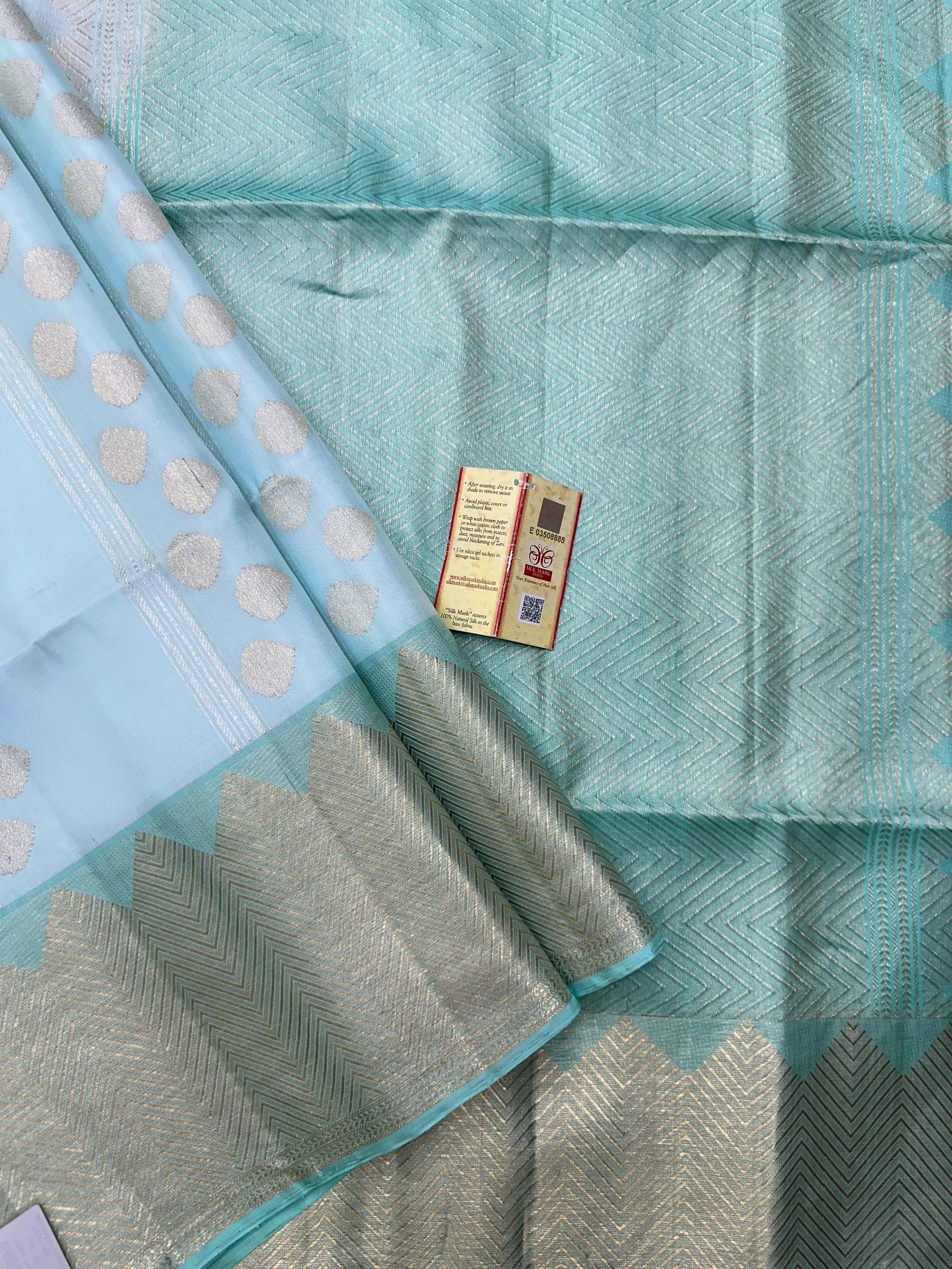 Woman draped in a Pure Kanjivaram Silk Saree with rich silk texture, vibrant colors, and traditional zari border, ideal for weddings and festivals.
