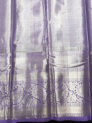 Pure Kanjivaram silk saree with golden zari border and rich silk texture – ideal for bridal and traditional wear