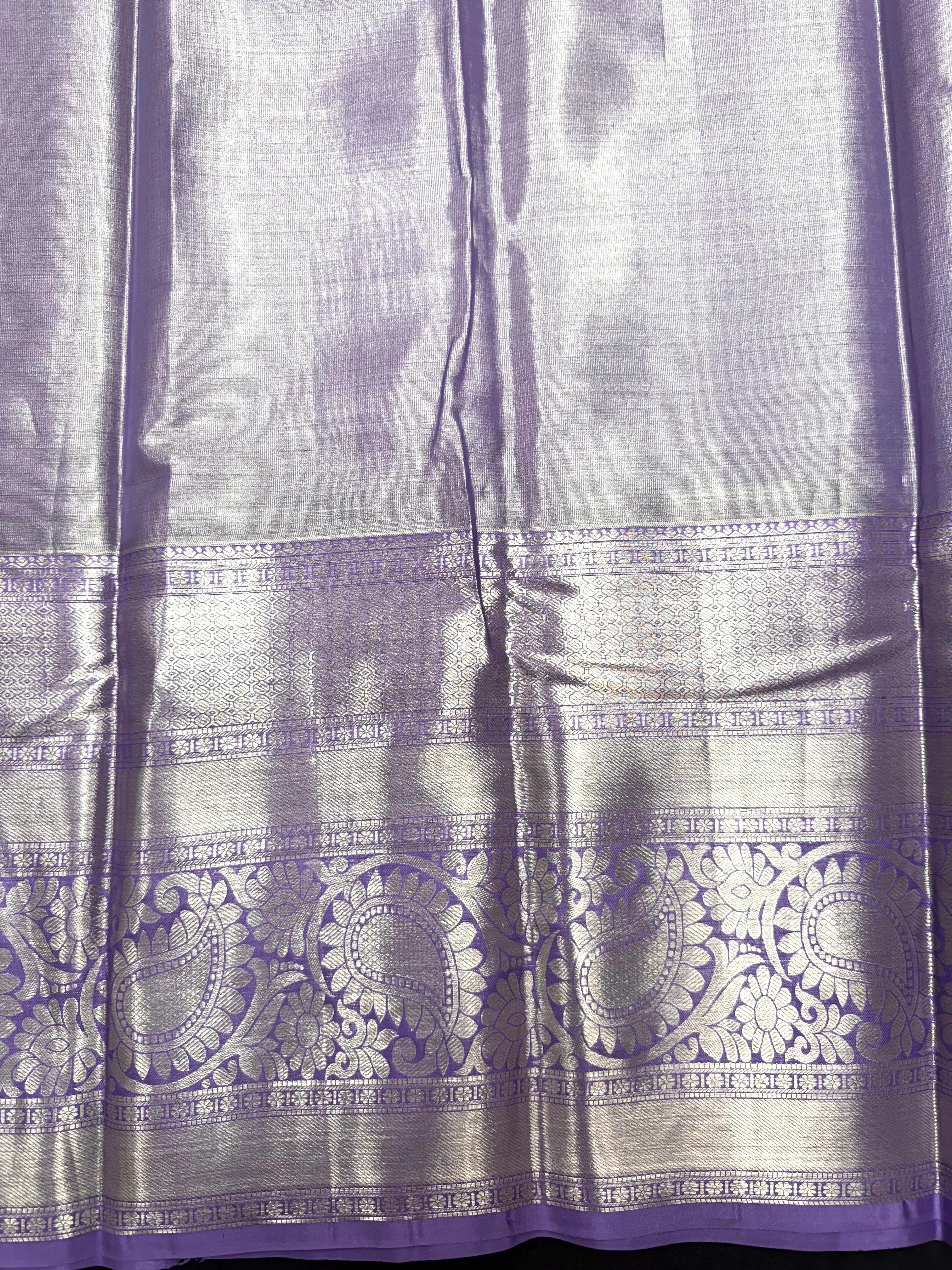 Pure Kanjivaram silk saree with golden zari border and rich silk texture – ideal for bridal and traditional wear
