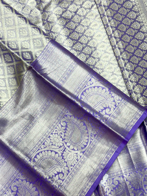 Pure Kanjivaram silk saree with golden zari border and rich silk texture – ideal for bridal and traditional wear
