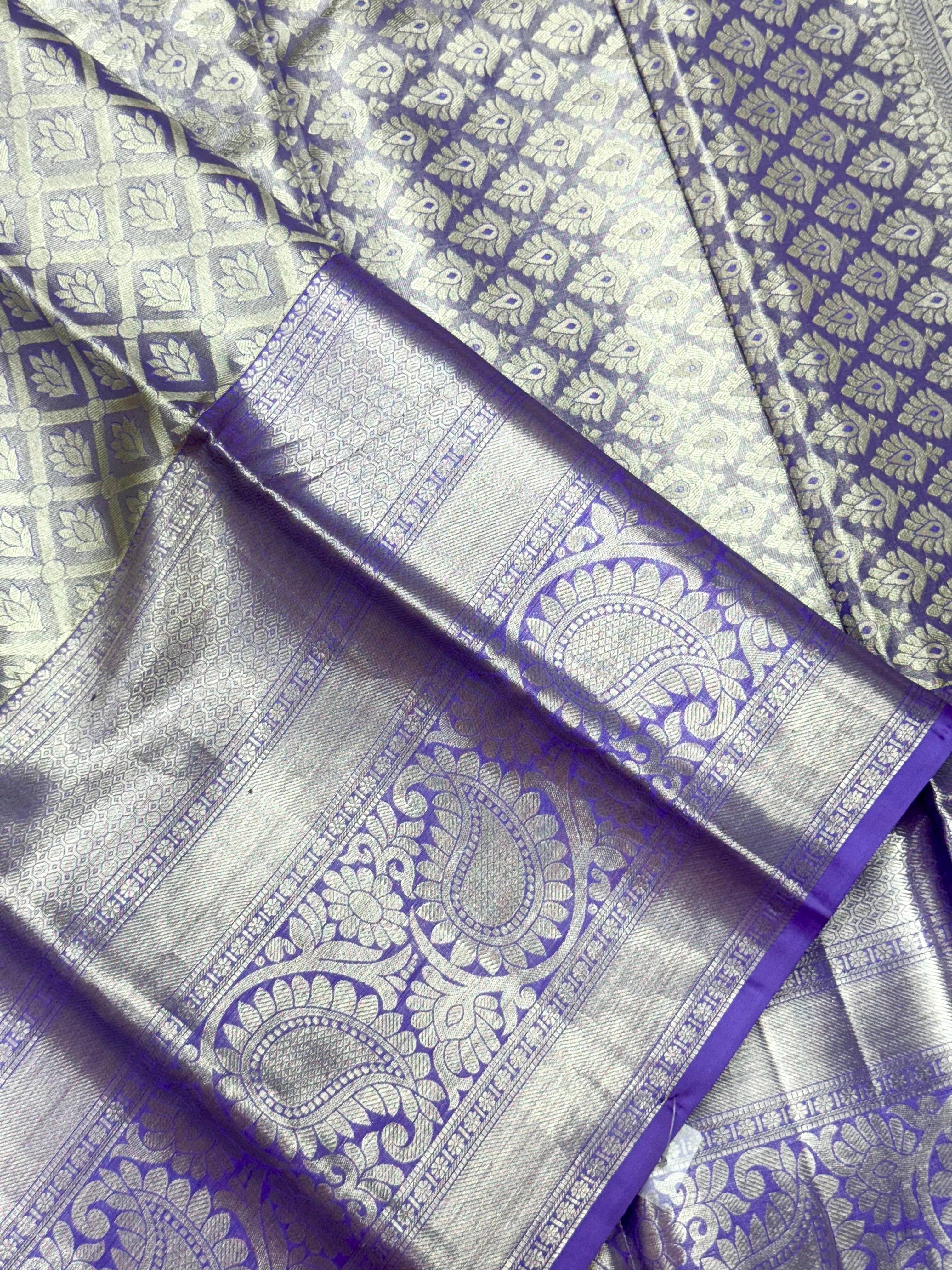 Pure Kanjivaram silk saree with golden zari border and rich silk texture – ideal for bridal and traditional wear