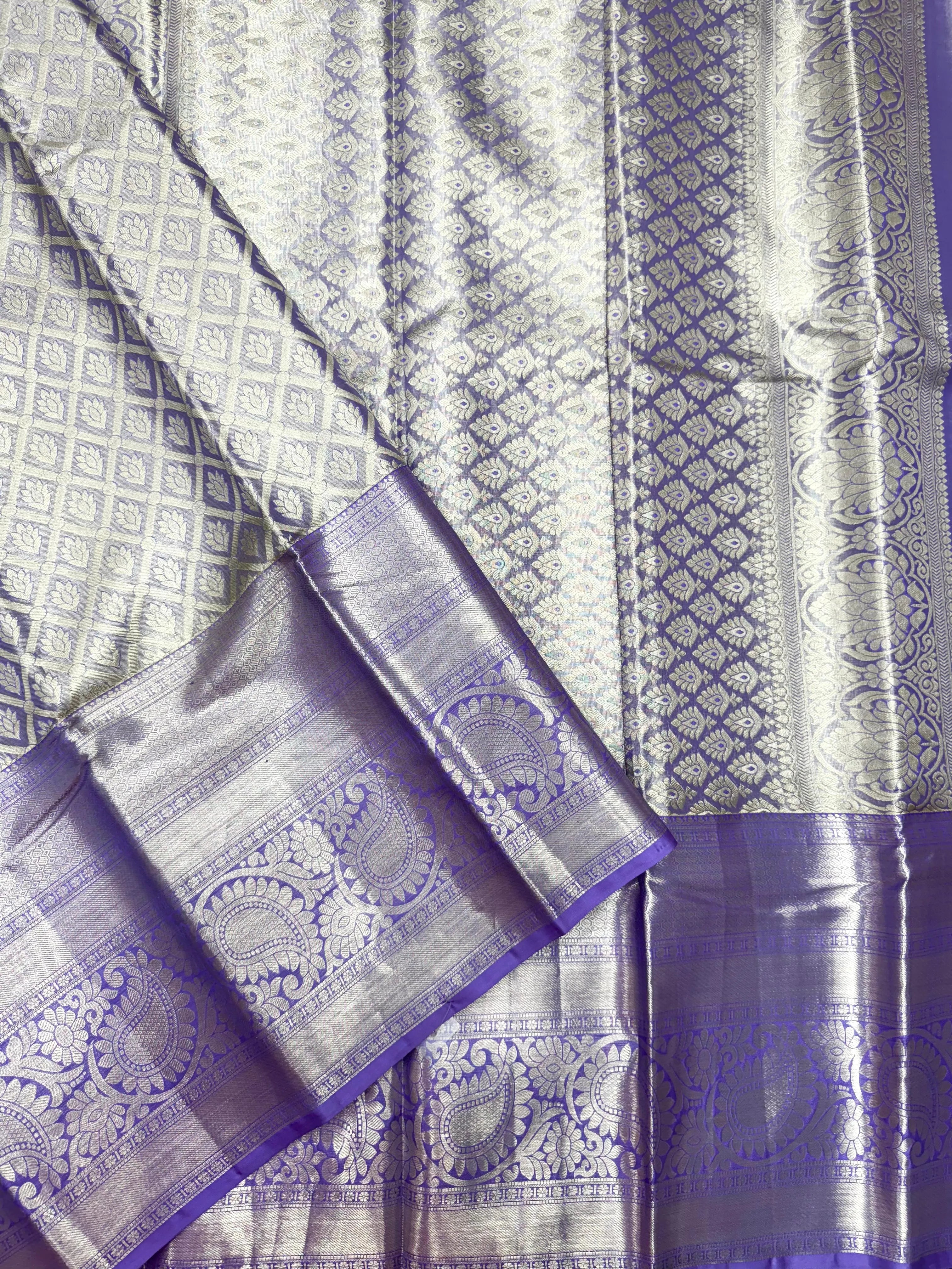 Pure Kanjivaram silk saree with golden zari border and rich silk texture – ideal for bridal and traditional wear

