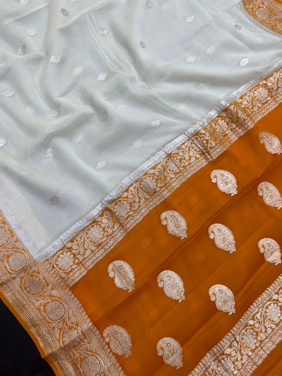 Woman wearing a Pure Khaddi Chiffon Saree with zari border and flowing drape – ideal for weddings and festive occasions.