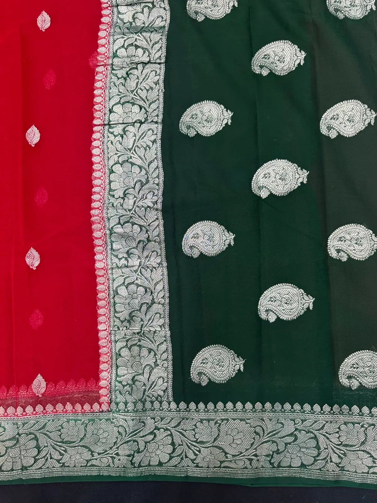 Woman wearing a Pure Khaddi Chiffon Saree with sheer, lightweight fabric and zari details, ideal for weddings and festive occasions.