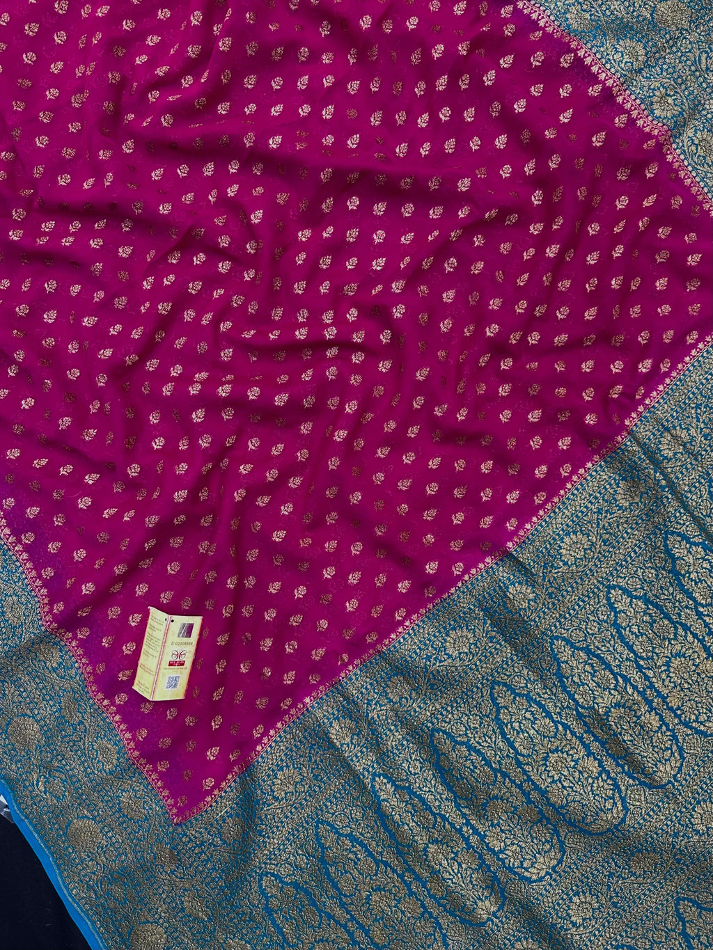 Woman wearing a Pure Khaddi Georgette Saree with rich zari work and flowing drape – ideal for festive and traditional occasions.