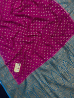 Woman wearing a Pure Khaddi Georgette Saree with rich zari work and flowing drape – ideal for festive and traditional occasions.