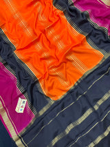 Woman wearing a Pure Mysore Crepe Silk Saree with lustrous sheen and elegant zari border, perfect for weddings and festive occasions.