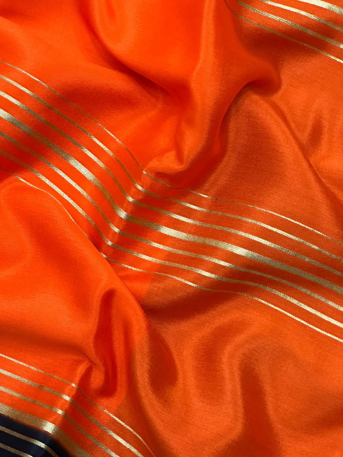 Woman wearing a Pure Mysore Crepe Silk Saree with lustrous sheen and elegant zari border, perfect for weddings and festive occasions.