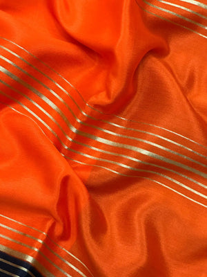 Woman wearing a Pure Mysore Crepe Silk Saree with lustrous sheen and elegant zari border, perfect for weddings and festive occasions.