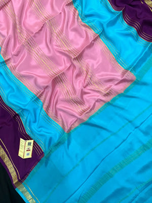 Woman wearing a Pure Mysore Crepe Silk Saree with lustrous sheen and elegant zari border, perfect for weddings and festive occasions.