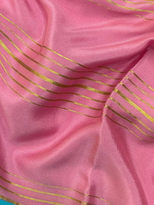 Woman wearing a Pure Mysore Crepe Silk Saree with lustrous sheen and elegant zari border, perfect for weddings and festive occasions.
