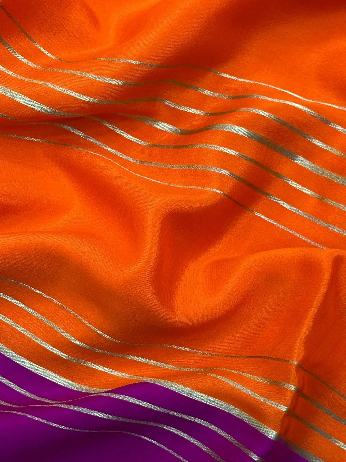 Woman wearing a Pure Mysore Crepe Silk Saree with lustrous sheen and elegant zari border, perfect for weddings and festive occasions.