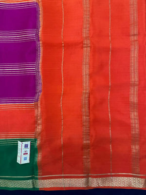 Woman wearing a Pure Mysore Crepe Silk Saree with lustrous sheen and elegant zari border, perfect for weddings and festive occasions.