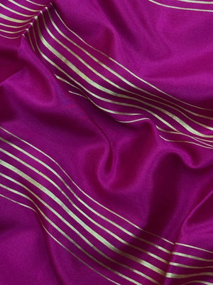 Woman wearing a Pure Mysore Crepe Silk Saree with lustrous sheen and elegant zari border, perfect for weddings and festive occasions.