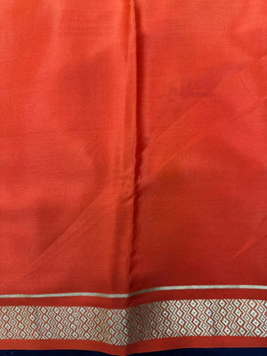 Woman wearing a Pure Mysore Crepe Silk Saree with lustrous sheen and elegant zari border, perfect for weddings and festive occasions.