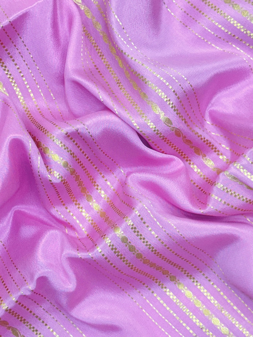 Woman wearing a Pure Mysore Silk Saree with smooth drape and zari border, perfect for weddings and traditional South Indian events.