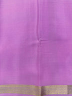 Woman wearing a Pure Mysore Silk Saree with smooth drape and zari border, perfect for weddings and traditional South Indian events.