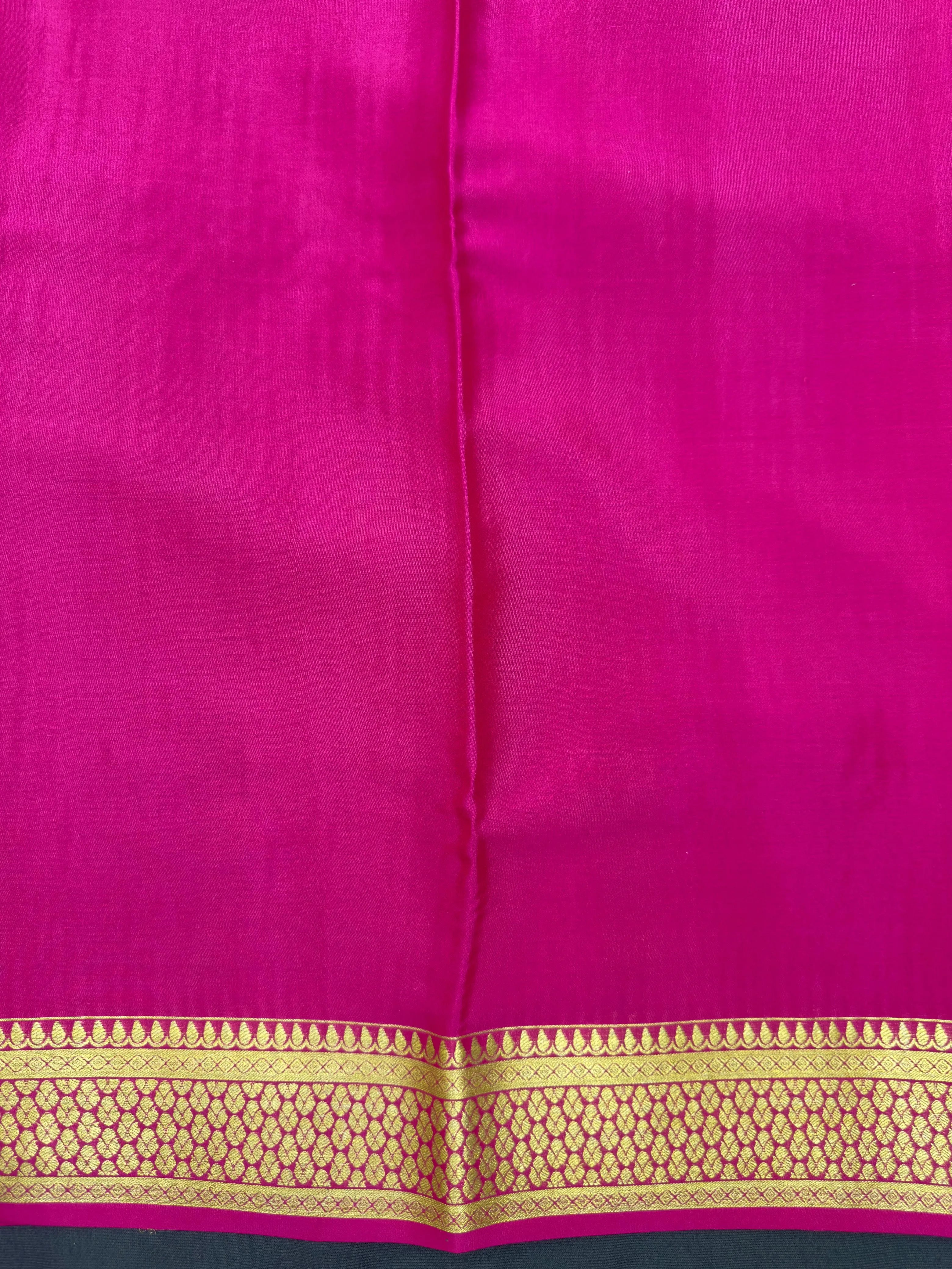 Pure Mysore silk saree with smooth texture and zari border – perfect for weddings and festive wear