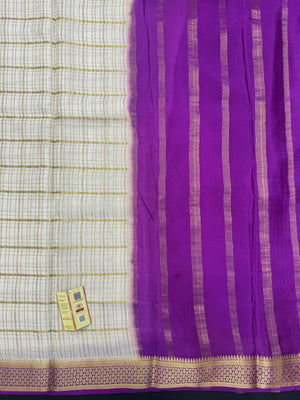 Pure Mysore silk saree with smooth texture and zari border – perfect for weddings and festive wear
