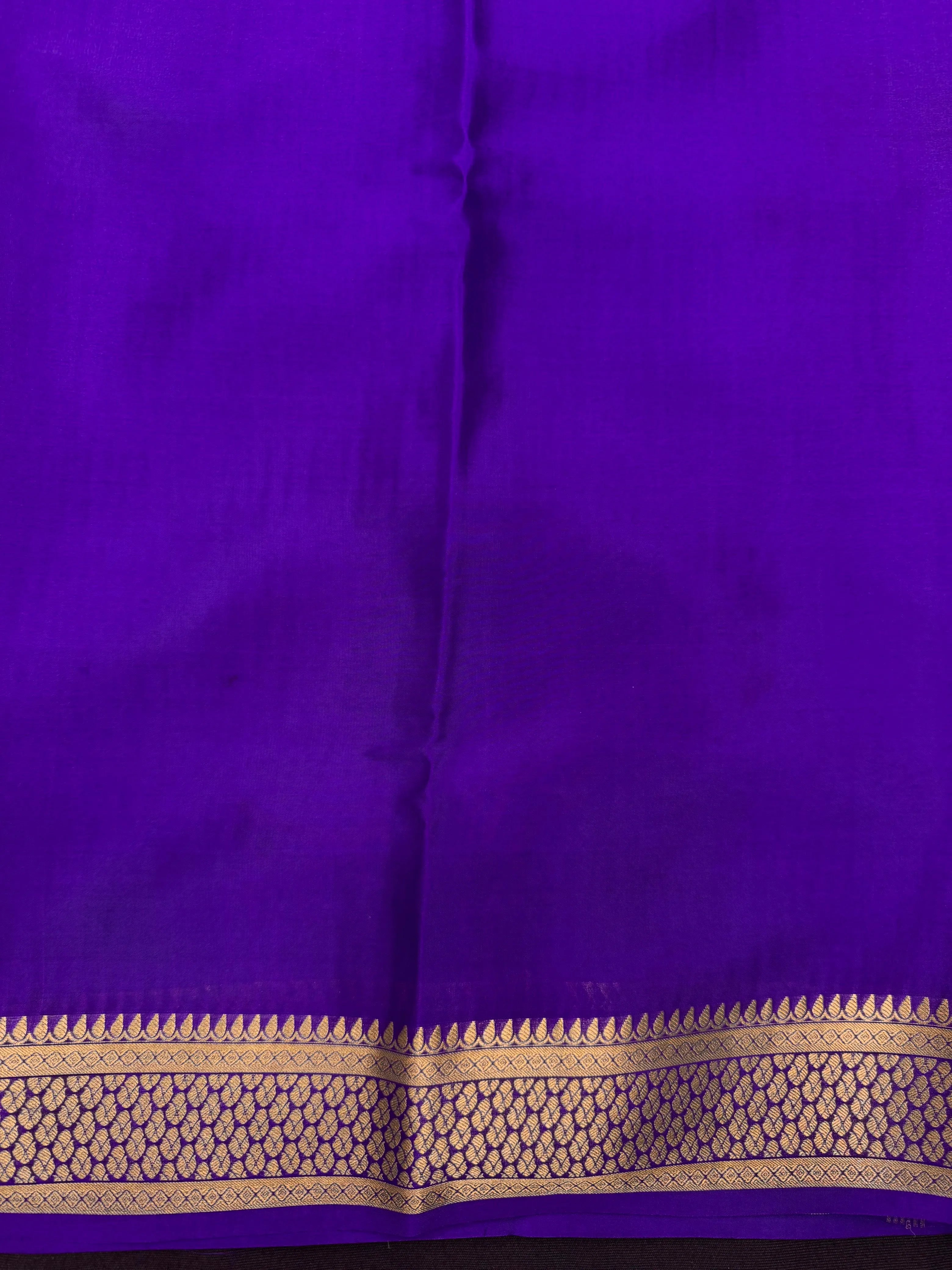 Pure Mysore silk saree with smooth texture and zari border – perfect for weddings and festive wear