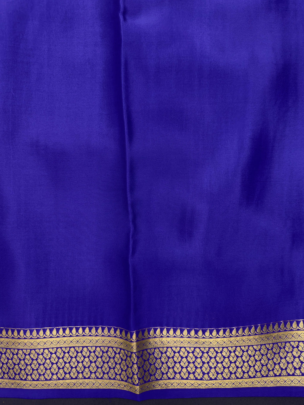 Pure Mysore silk saree with smooth texture and zari border – perfect for weddings and festive wear