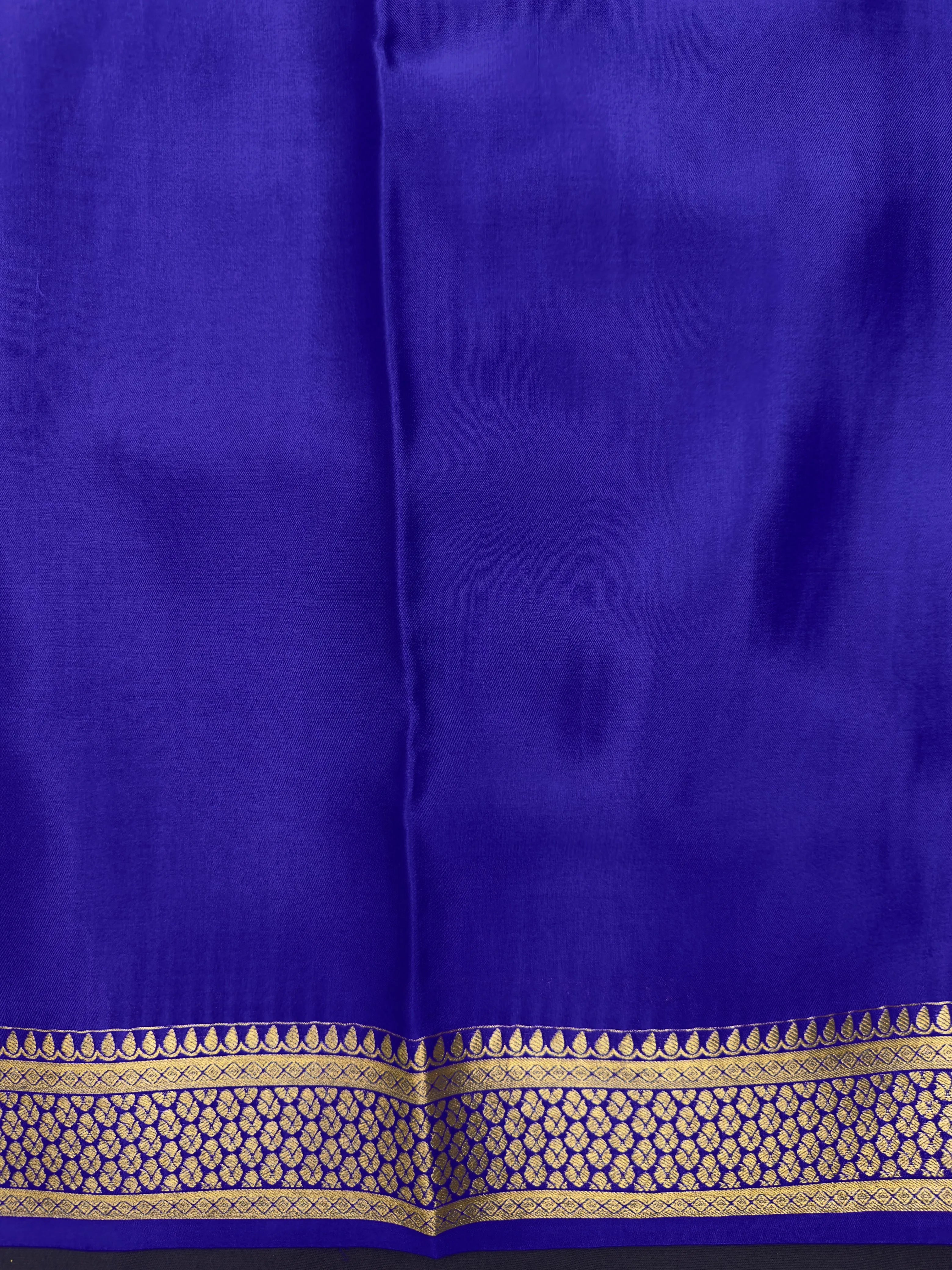 Pure Mysore silk saree with smooth texture and zari border – perfect for weddings and festive wear