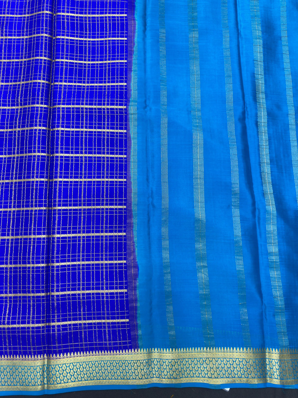 Pure Mysore silk saree with smooth texture and zari border – perfect for weddings and festive wear