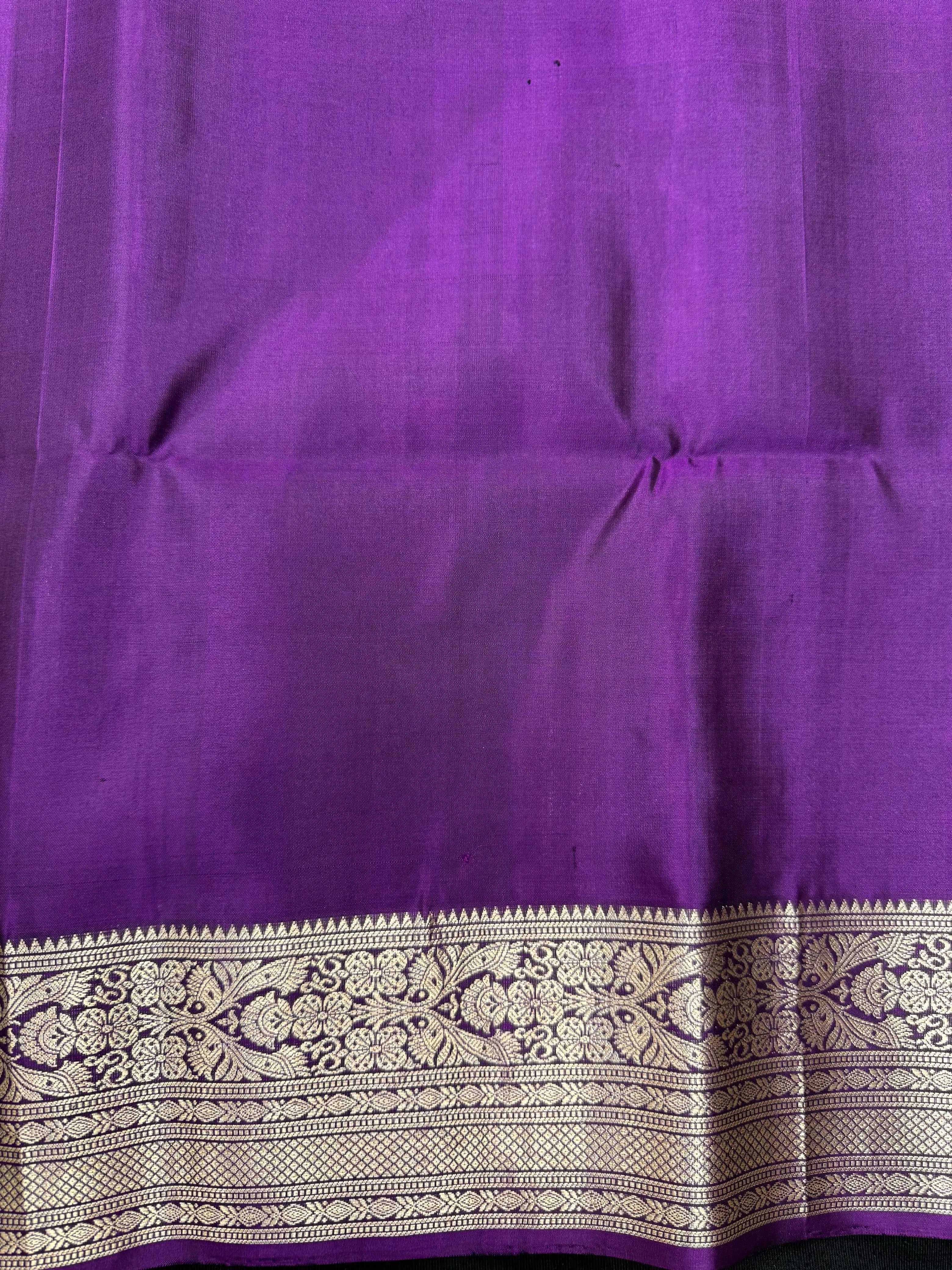 Woman draped in a Pure Pochampally Saree showcasing handwoven Ikat patterns in vibrant colors, representing traditional Telangana craftsmanship.