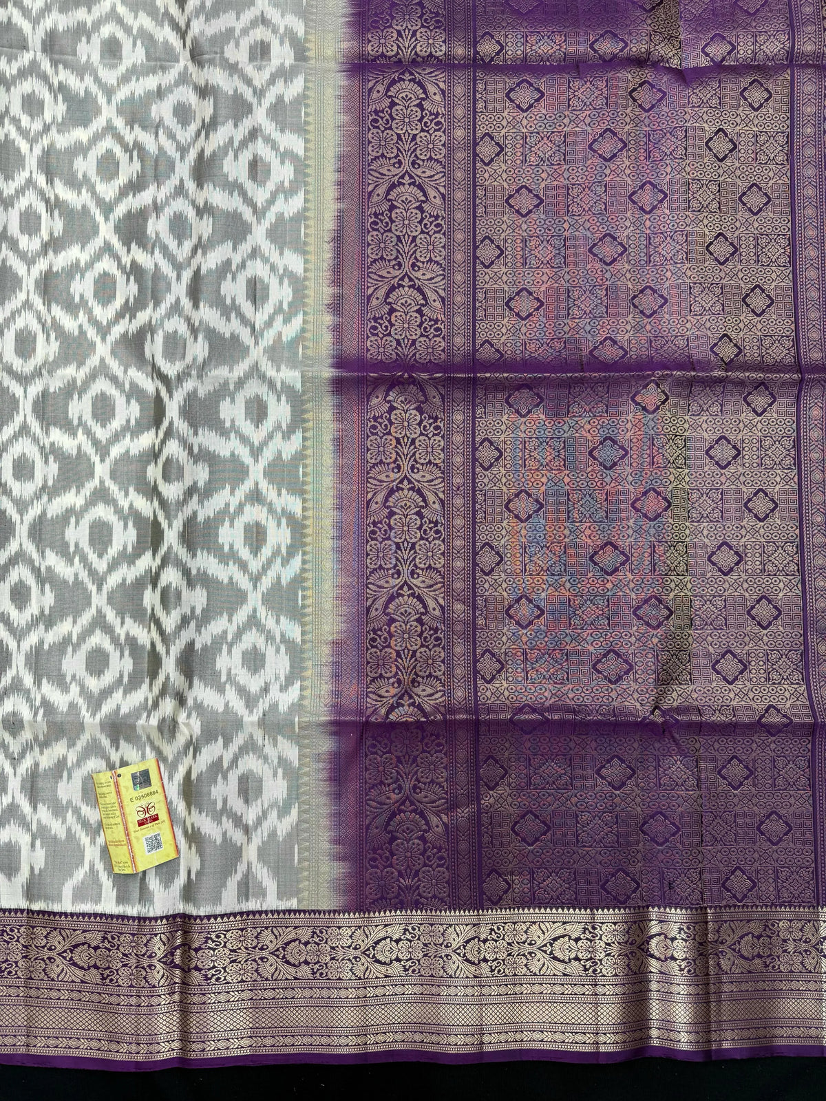 Woman draped in a Pure Pochampally Saree showcasing handwoven Ikat patterns in vibrant colors, representing traditional Telangana craftsmanship.