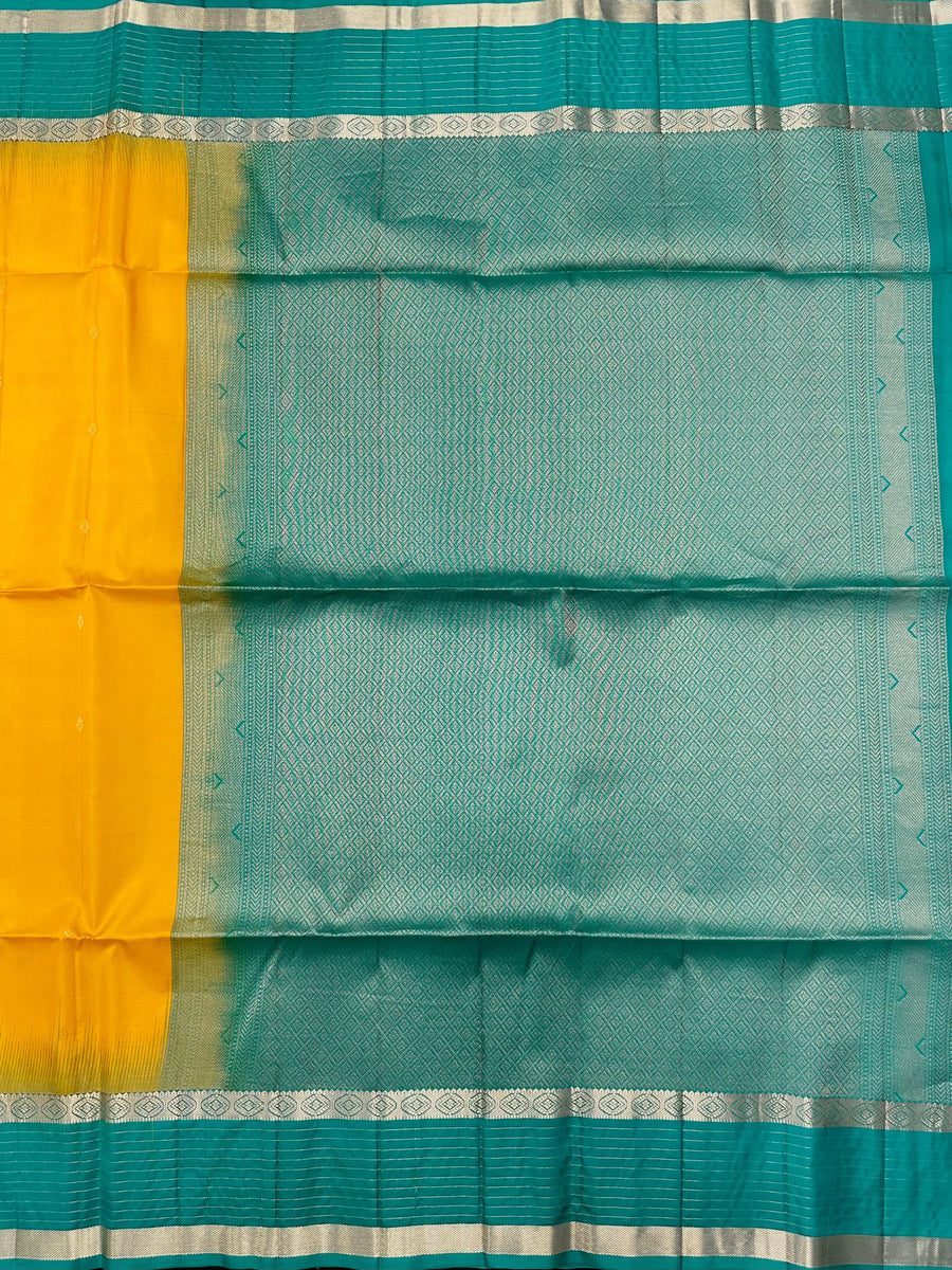 Woman wearing a Pure Silk Saree with glossy finish and intricate detailing, ideal for weddings and ethnic celebrations.