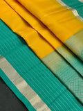 Woman wearing a Pure Silk Saree with glossy finish and intricate detailing, ideal for weddings and ethnic celebrations.