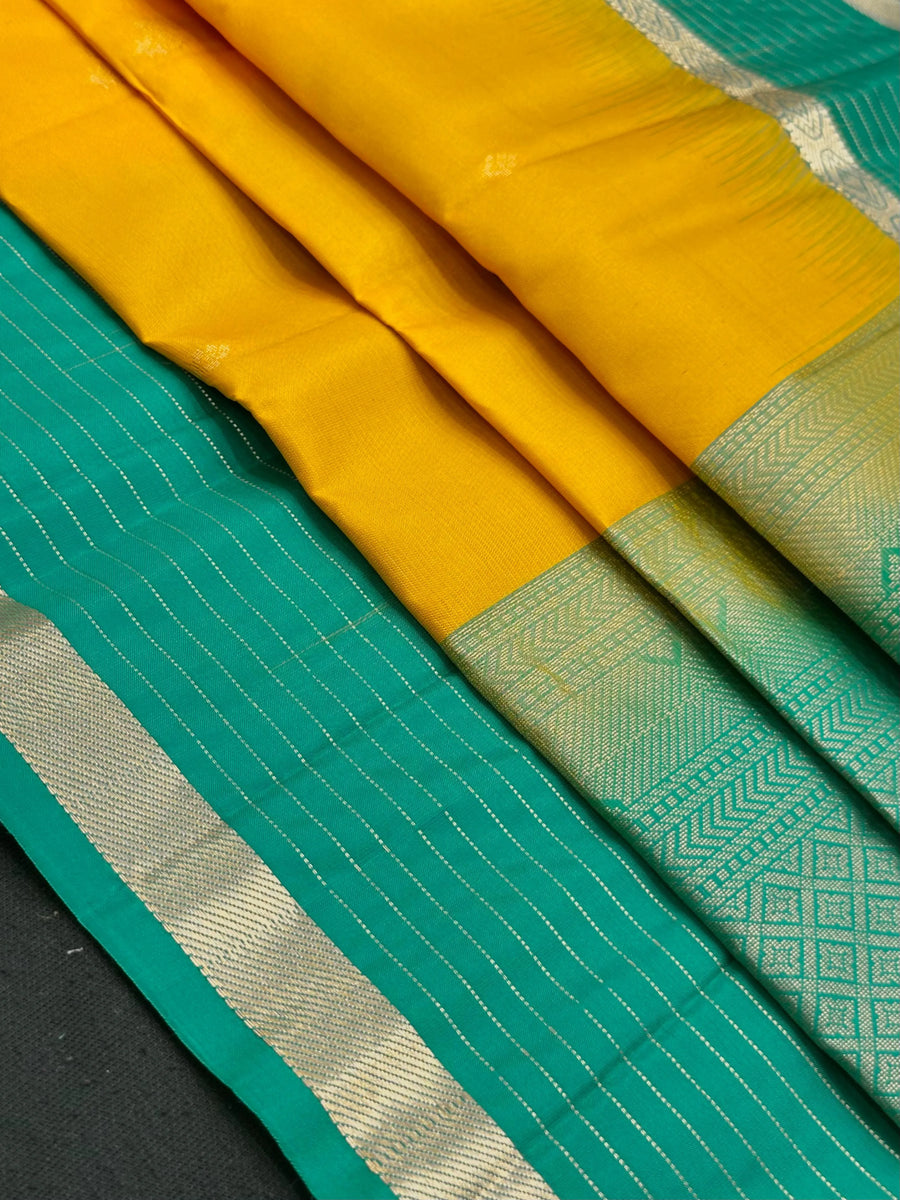 Woman wearing a Pure Silk Saree with glossy finish and intricate detailing, ideal for weddings and ethnic celebrations.