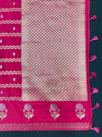 Woman wearing a Raw Mango Silk Saree with rich handloom texture and subtle sheen – perfect for weddings and festive occasions.