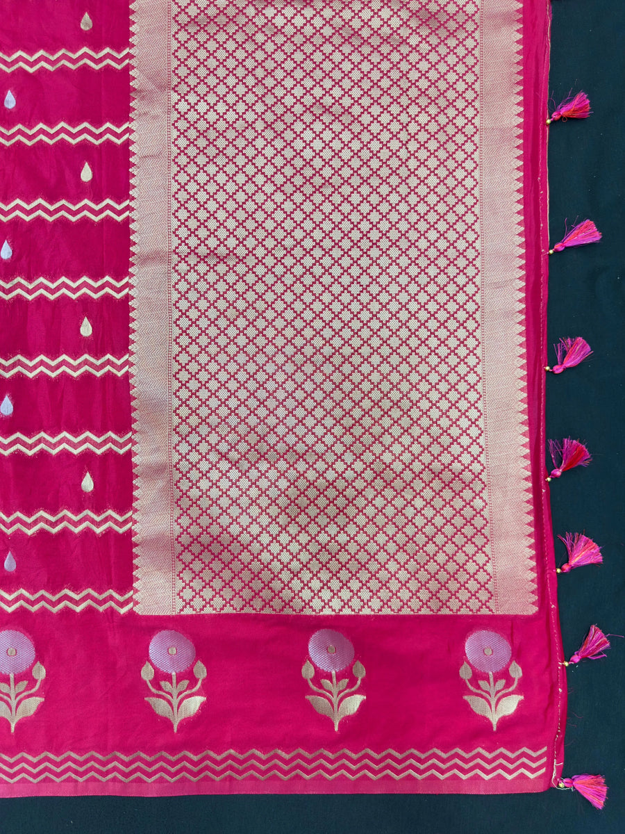 Woman wearing a Raw Mango Silk Saree with rich handloom texture and subtle sheen – perfect for weddings and festive occasions.